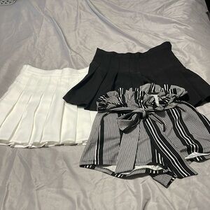 Set of 3: striped tie shorts, white pleated skort, & black pleated skirt